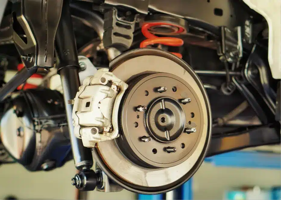 Brake repair in St. Charles by Precision Motorworks. Image of a vehicle’s brake system with rotor and caliper exposed, showcasing the shop’s commitment to precise brake service, driver safety, and reliable stopping performance.