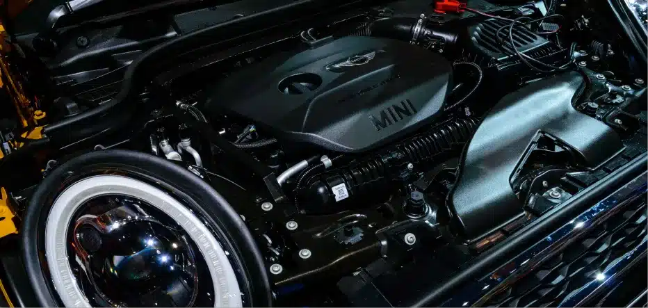 Mini Cooper repair in St. Charles, IL by Precision Motorworks. Image of a Mini Cooper engine bay, showcasing the shop’s expertise in European vehicle service with a focus on precision, reliability, and performance.