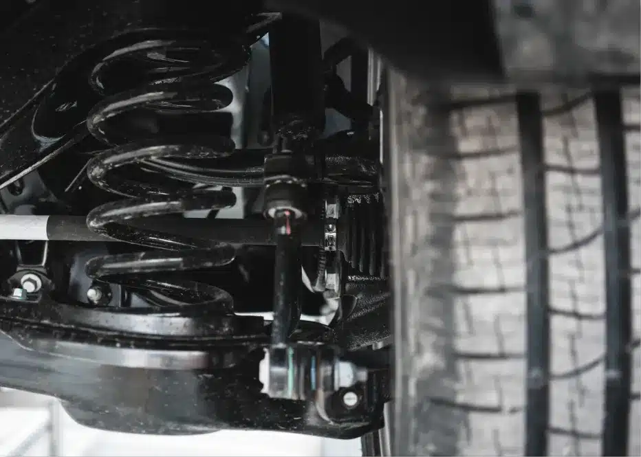 Steering & suspension repair in St. Charles, IL by Precision Motorworks. Image of a vehicle’s suspension system and tire, highlighting the shop’s dedication to ride stability, safety, and precise handling performance.