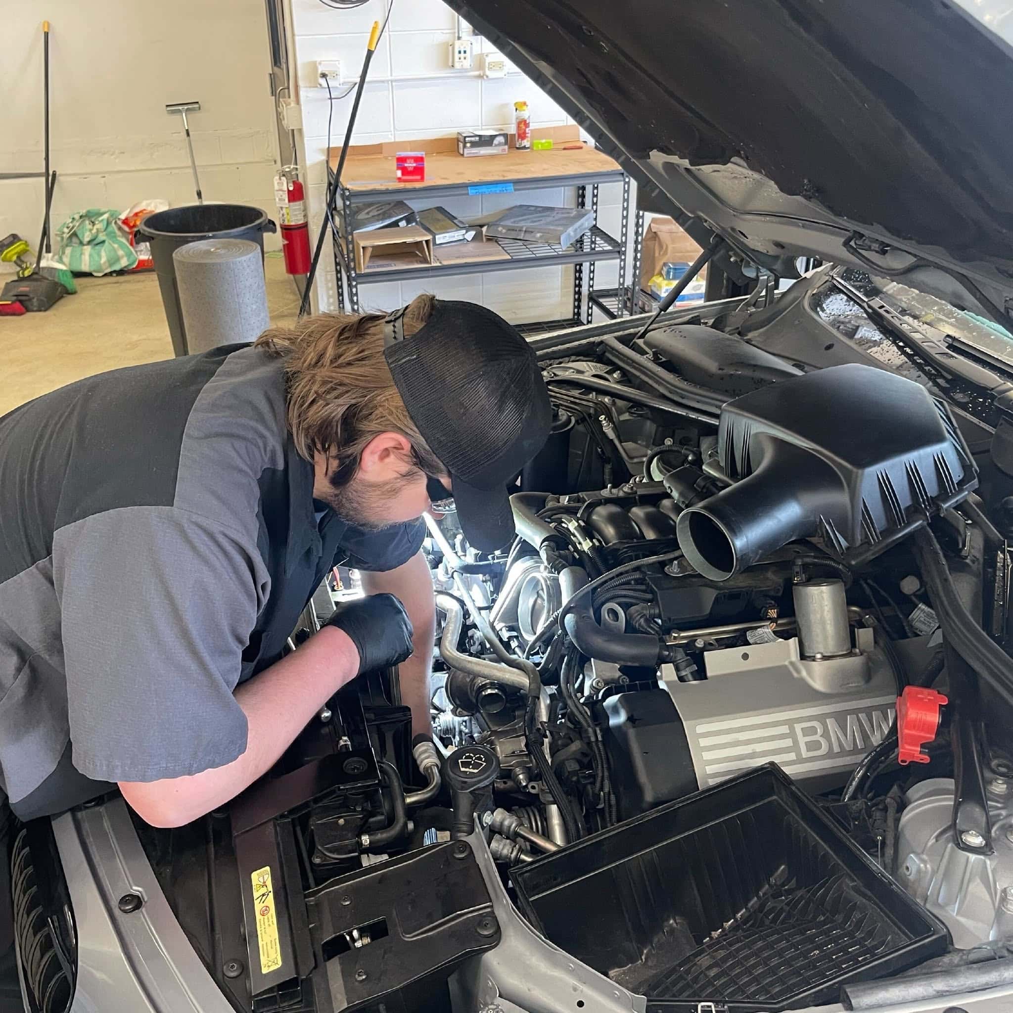 Factory Maintenance & Scheduled Service in St. Charles: A mechanic doing an auto maintenance for European auto owners in Saint Charles, IL
